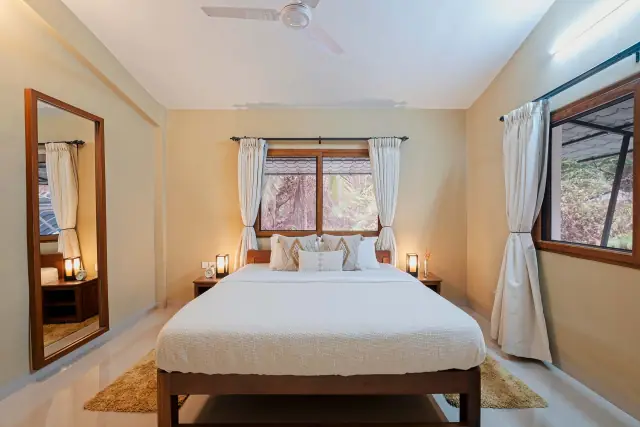 King bedroom with a full-length mirror