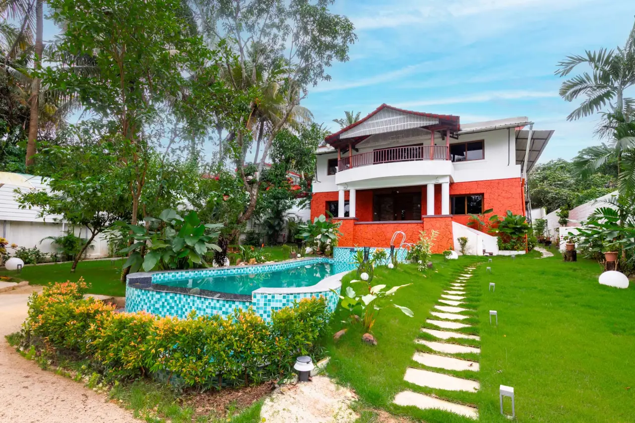 Stepping-stone path across the lawn to the villa